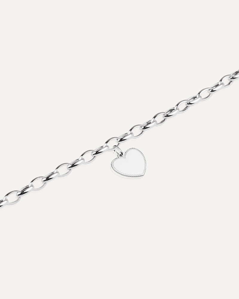 Pulsera con colgante de corazón personalizable en plata de ley.