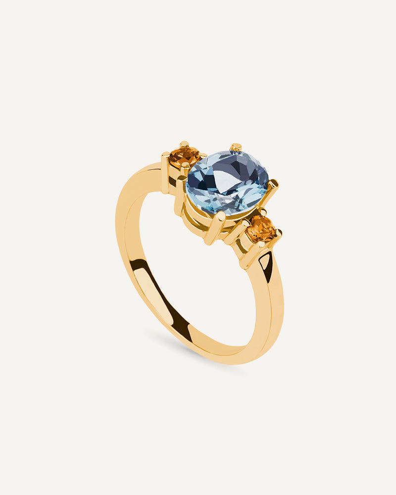Anillo Luxe en plata de ley con baño de oro y con topacio azul Sky y cuarzo citrino
