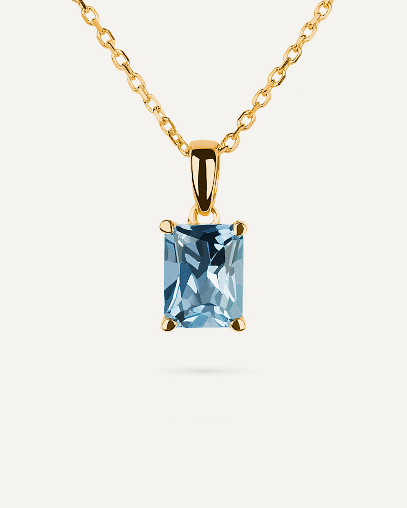 Collar Luxe en plata de ley con baño de oro y con topacio azul Sky talla octogonal.