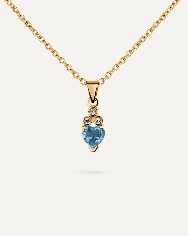 Collar Petite en plata de ley con baño de oro y con topacio Sky en talla corazón.